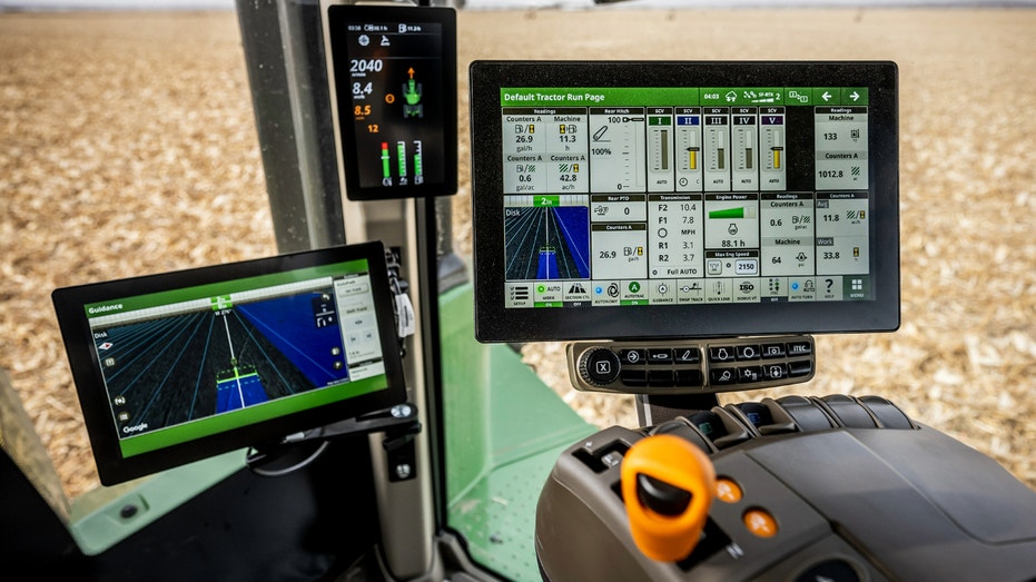 The inside of a John Deere farming vehicle.