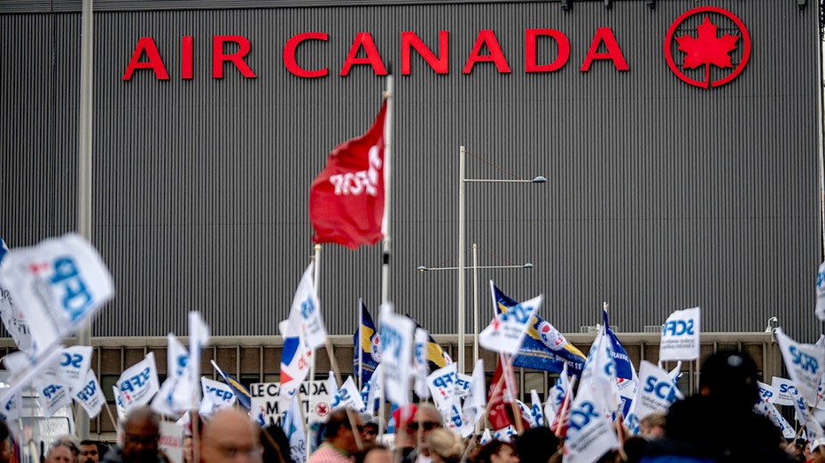 Flight attendants protest in front of the Air Canada headquarters near Pierre-Elliott Trudeau Airport in Montreal, Quebec, Canada, on August 17, 2025. 