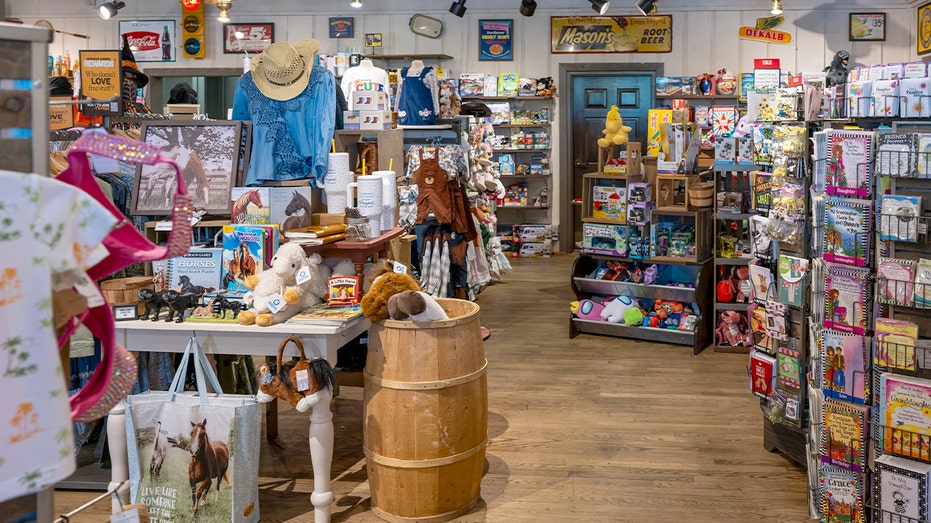 Interior of a Cracker Barrel restaurant featuring rustic decor and dining tables set for guests.