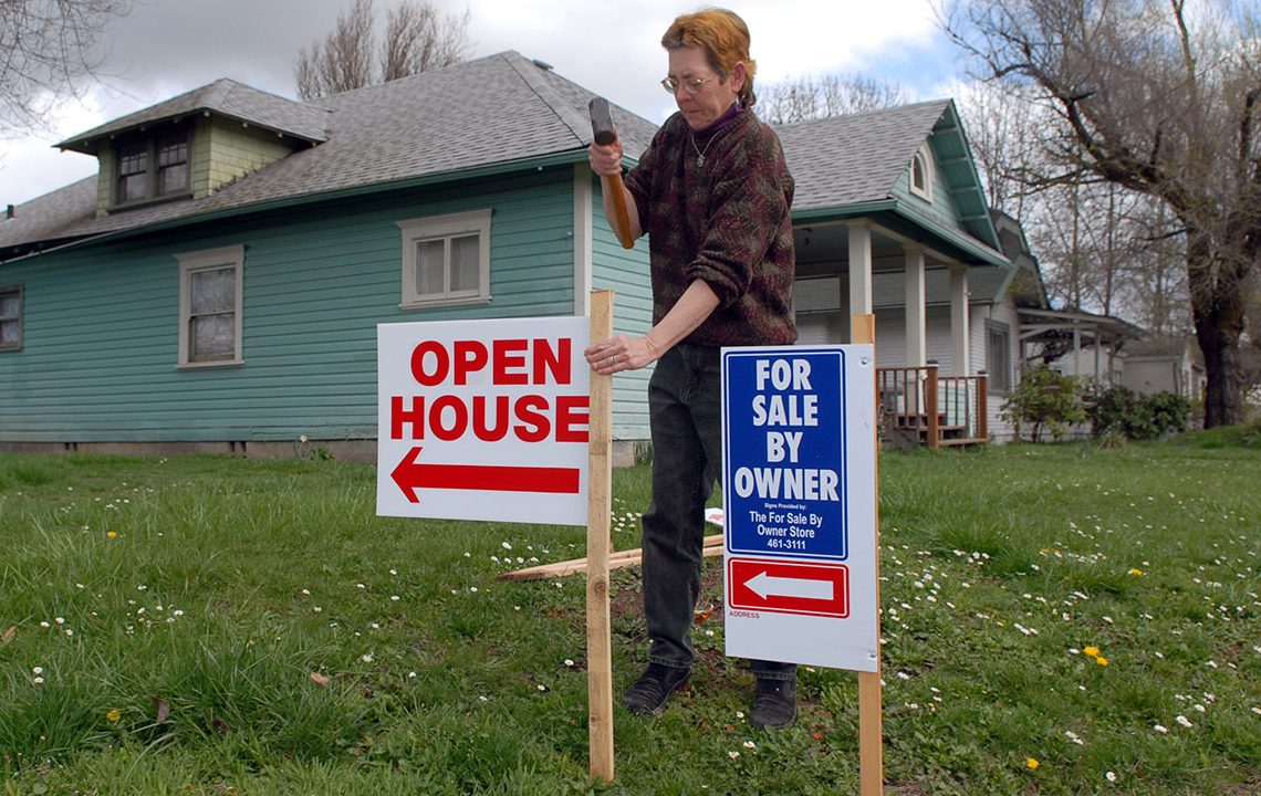 Mortgage rates edge lower, hover near 6%