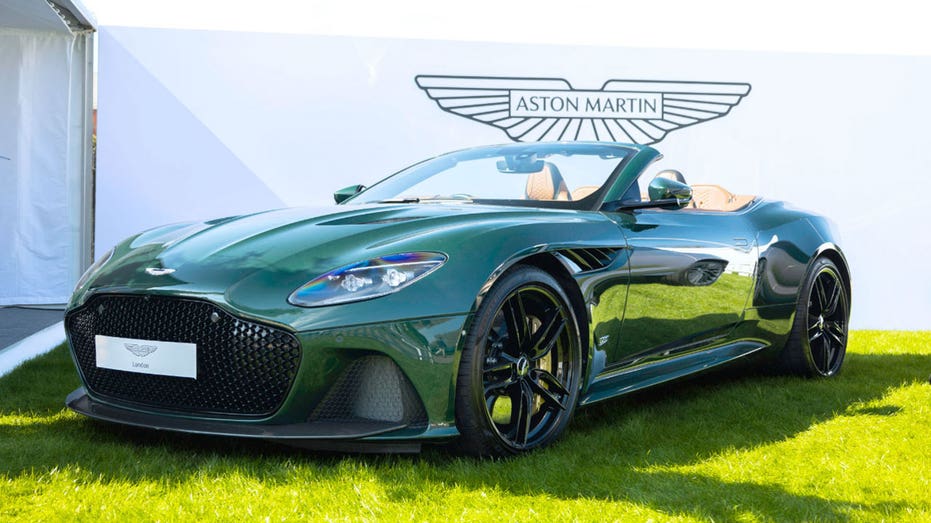 An Aston Martin DBS convertible with the top down.