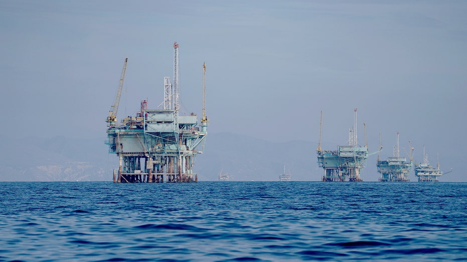 Multiple offshore oil platforms operating in the Pacific Ocean off the coast of Santa Barbara, California.